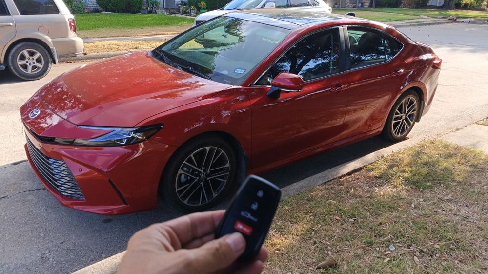 Push-to-start key for a red Toyota Camry