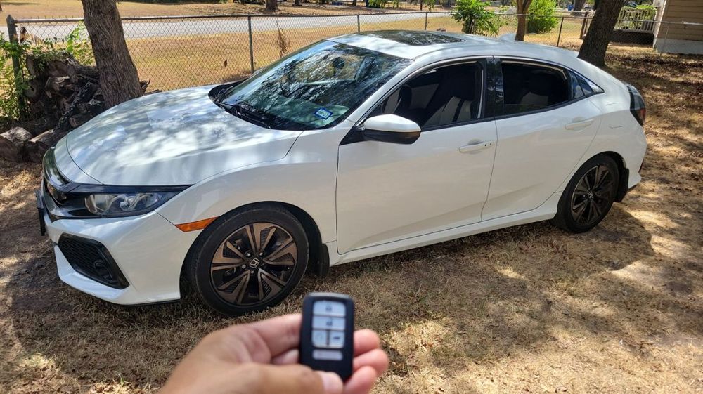 Smart key for a white Honda Civic hatchback